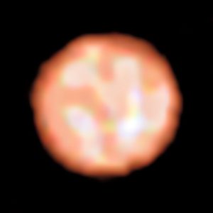 The surface of the red giant star π1 Gruis from PIONIER on the
